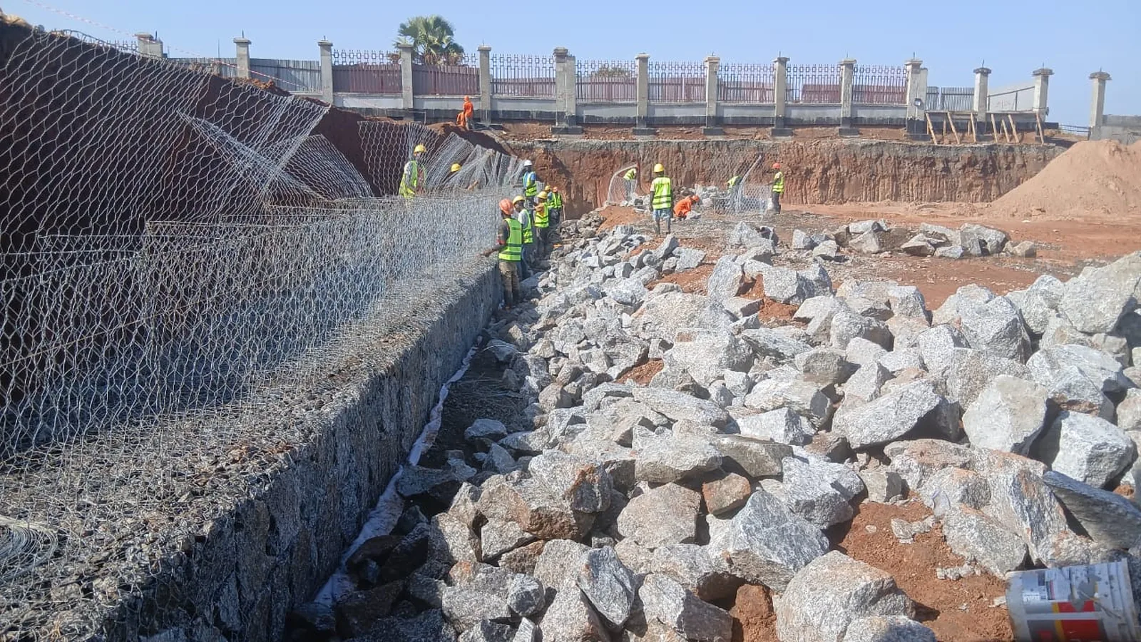 Tetrabuild crew building a gabion retaining structure on site