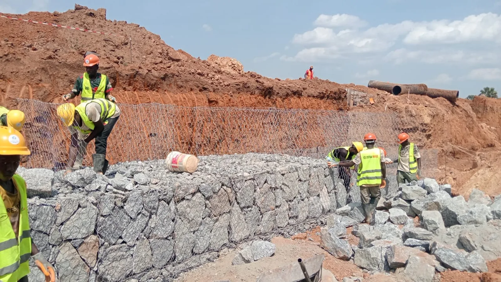 Tetrabuild crew building a gabion retaining structure on site