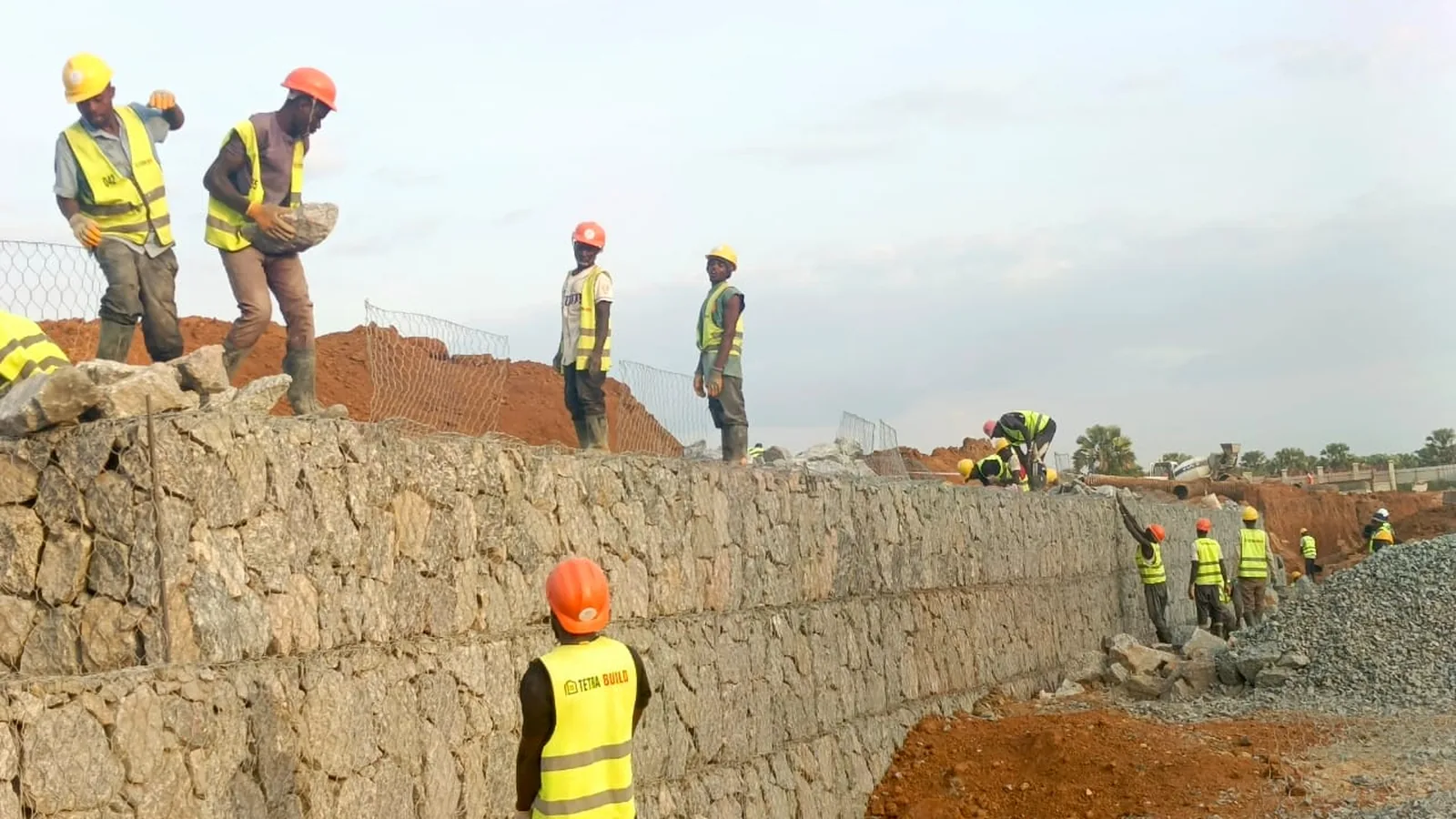 Tetrabuild crew building a gabion retaining structure on site