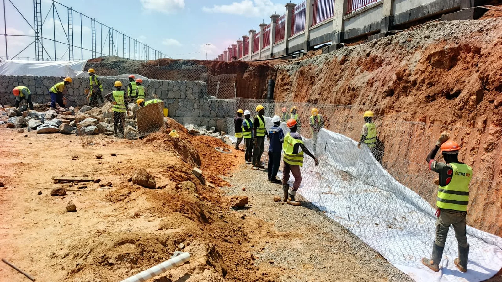 Tetrabuild crew building a gabion retaining structure on site