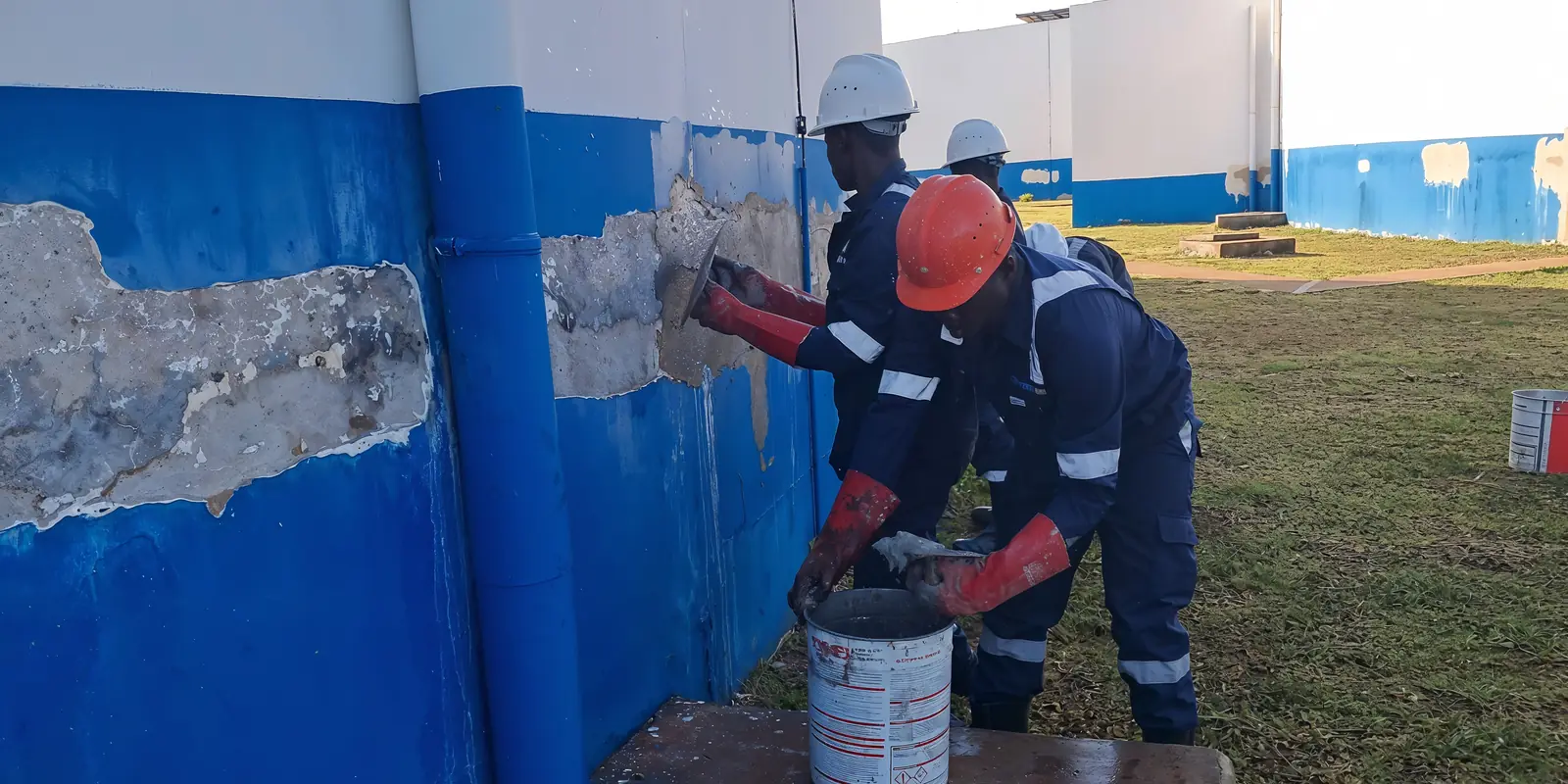 Tetrabuild technicians preparing and repairing a water-retaining wall on the NWSC Nsamba project