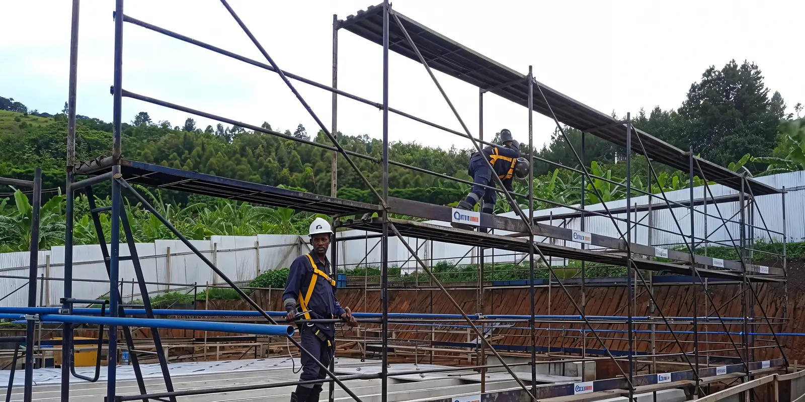 Tetrabuild scaffolding and support systems erected over concrete water-retaining tanks