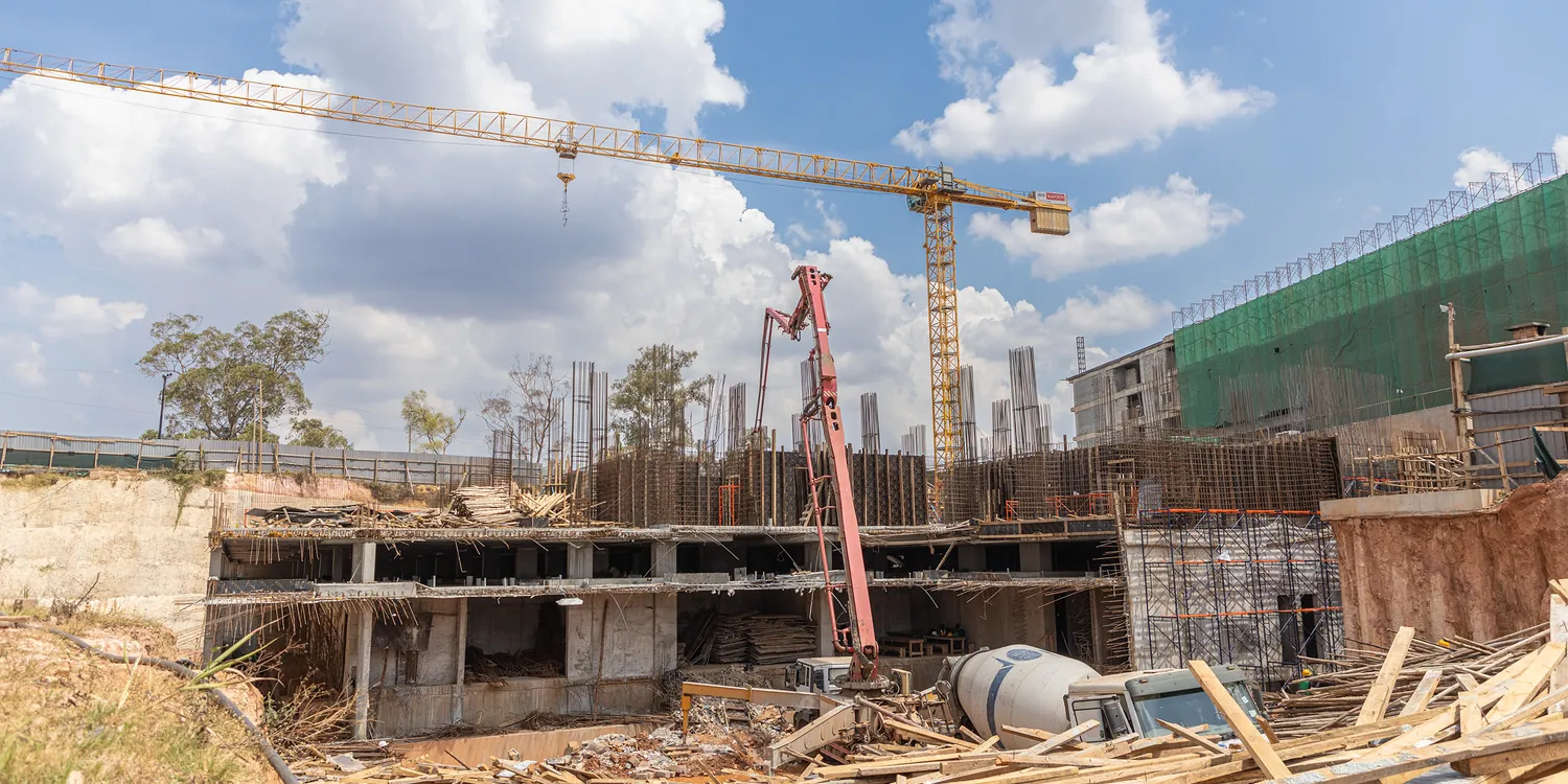 Tetrabuild project under construction in Kampala with a tower crane over the reinforced concrete frame
