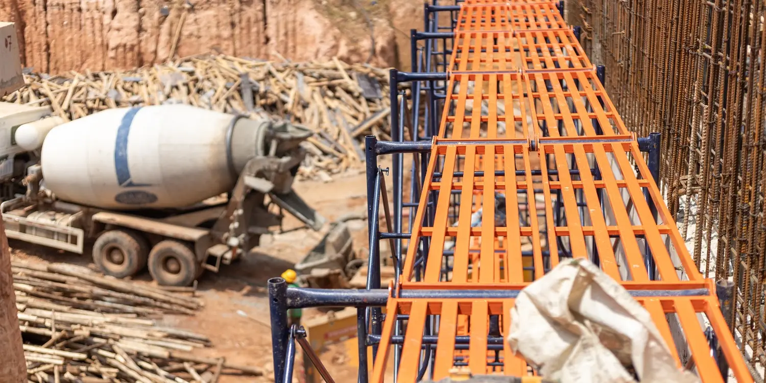 Tetrabuild formwork and reinforcement laid out on site with a concrete mixer truck alongside