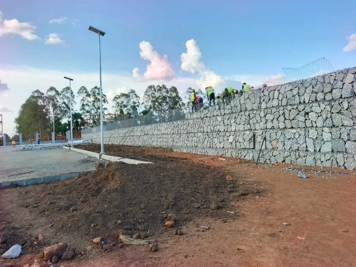Completed stone-filled gabion retaining wall built by Tetrabuild at Akii Bua Memorial Stadium