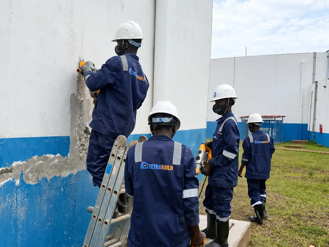 Tetrabuild crew carrying out repairs to an industrial facility wall